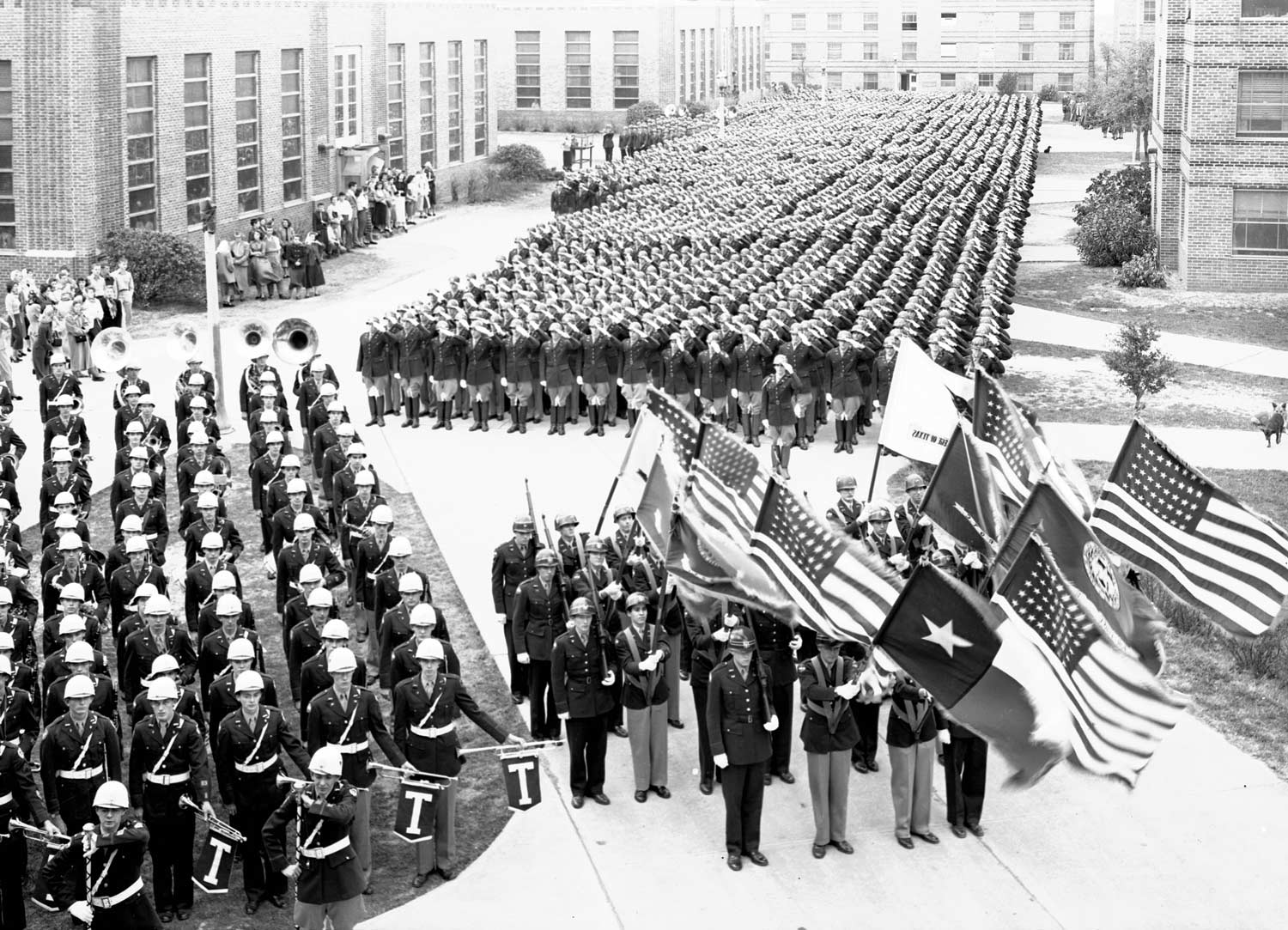 historical image of the Aggie Band on campus