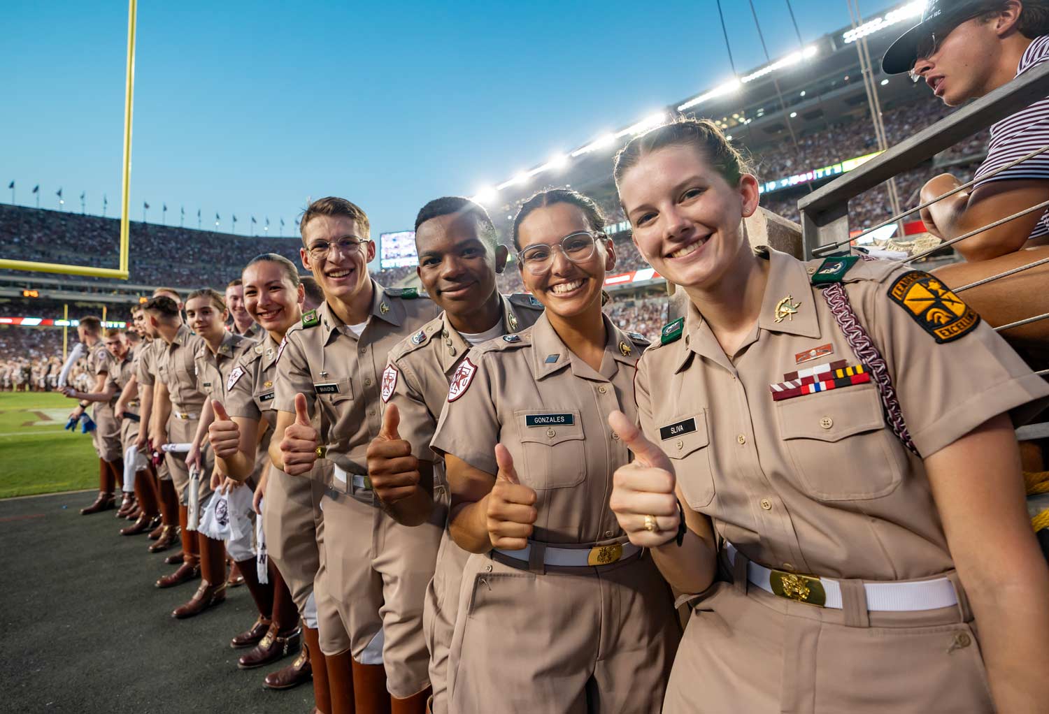 Corps of Cadets members posing at a football game