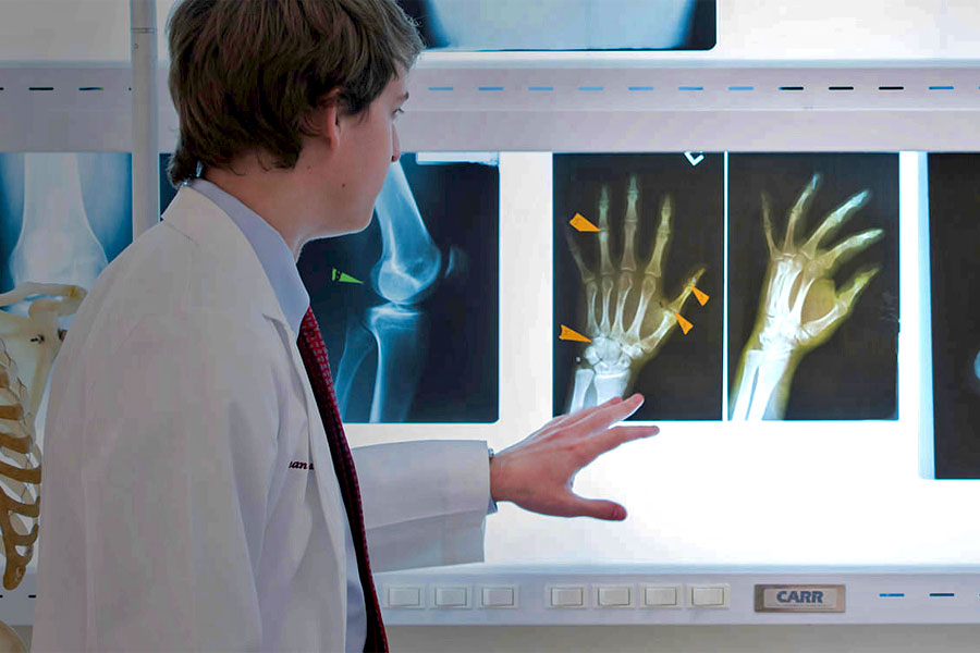 School of Medicine student reviews x-rays