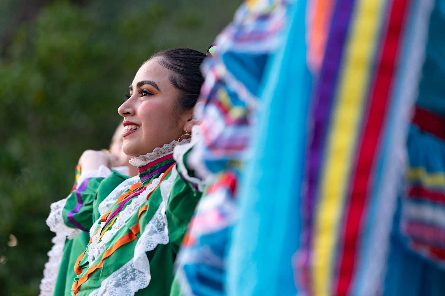 Texas A&M student performing a traditional dance in Aggie Park for Hispanic Heritage Month