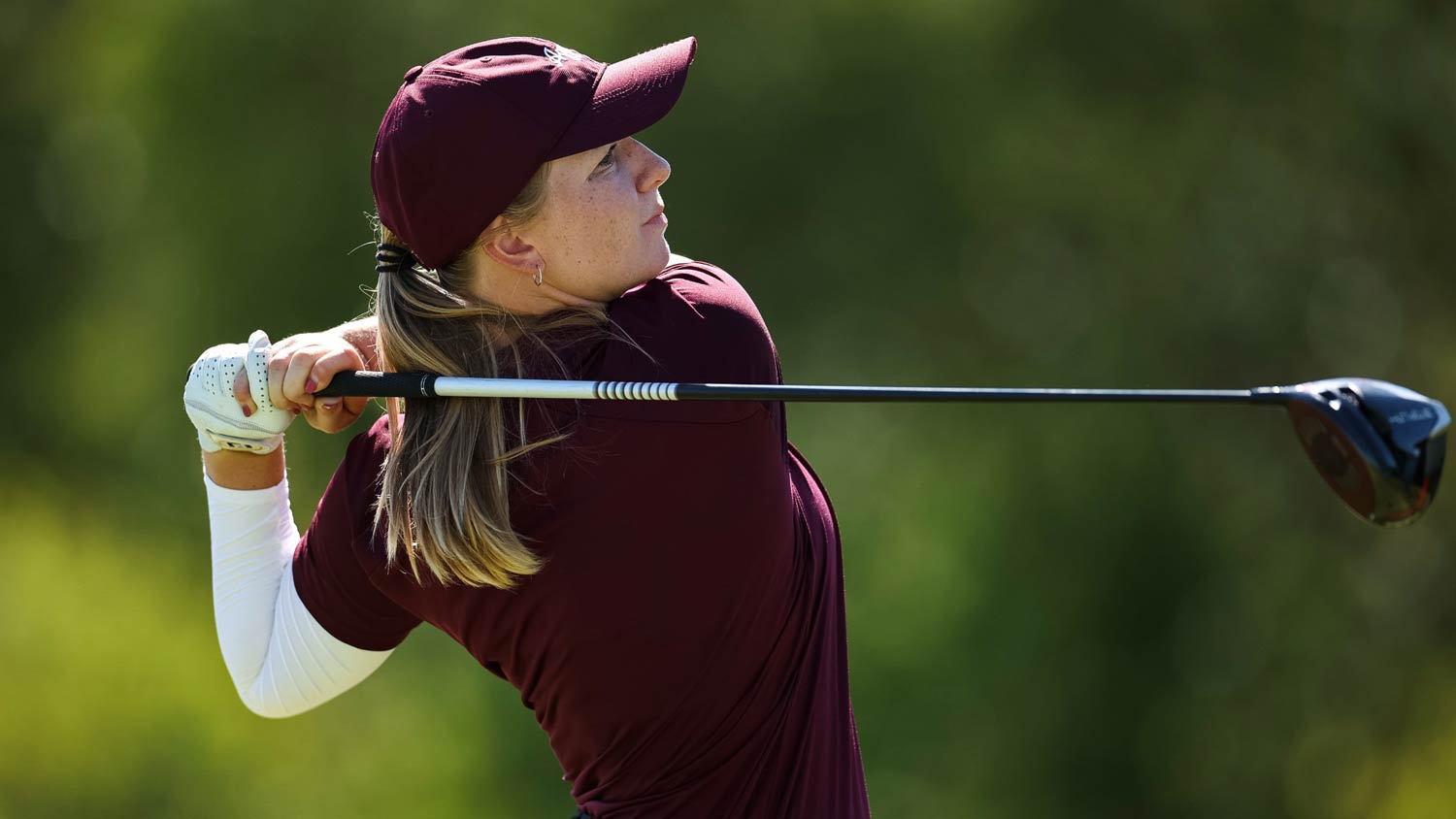 A Texas A&M golfer at the end of her swing