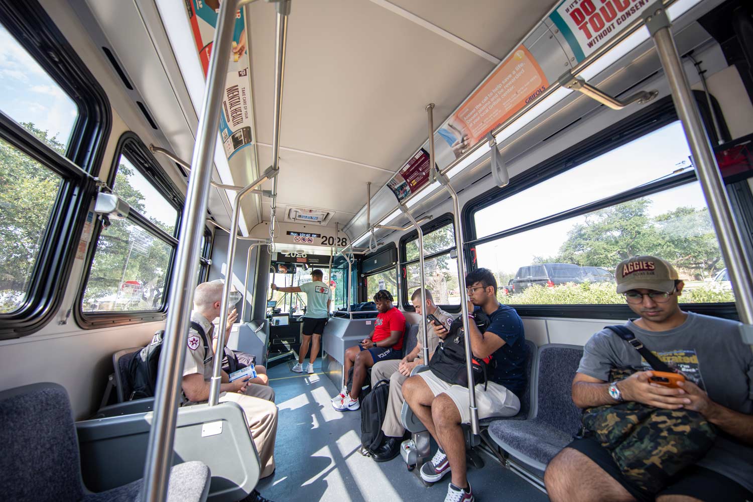 Inside view of aggie students riding the bus to class