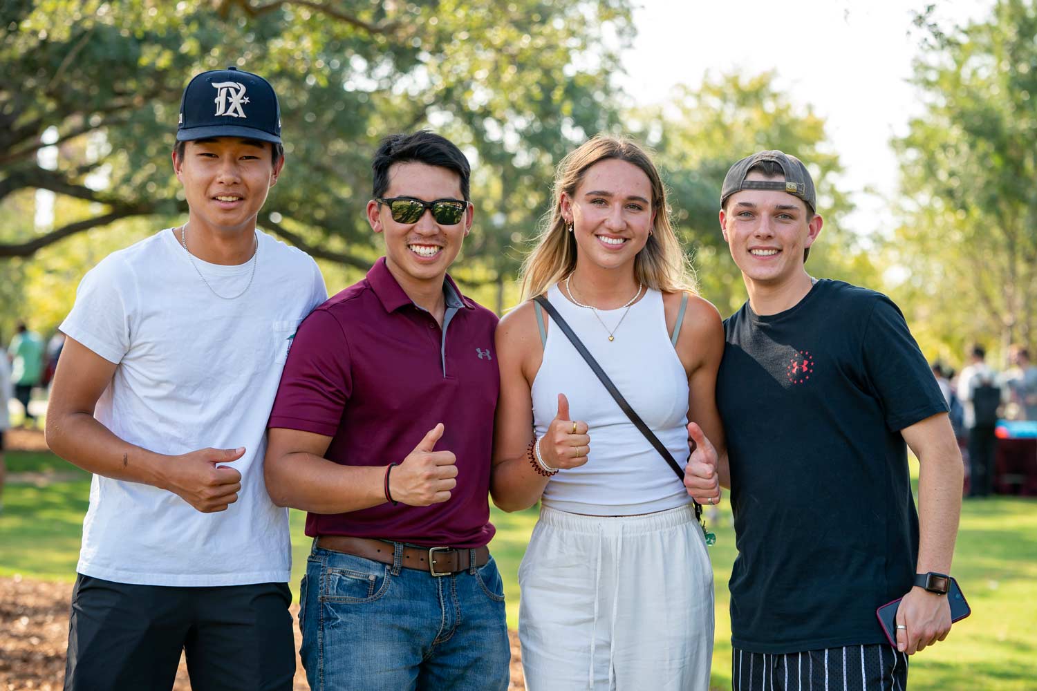 Texas A&M Students posing for a photo at Aggie Park