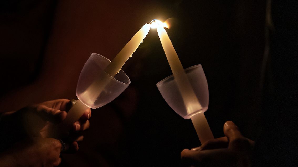 candles being lit at muster in rememberance