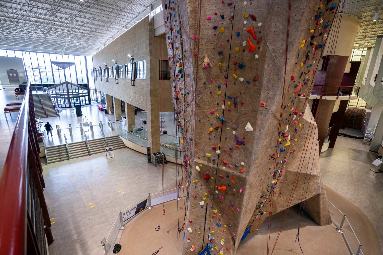 Inside the West Campus student rec center, highlighting the climbing wall