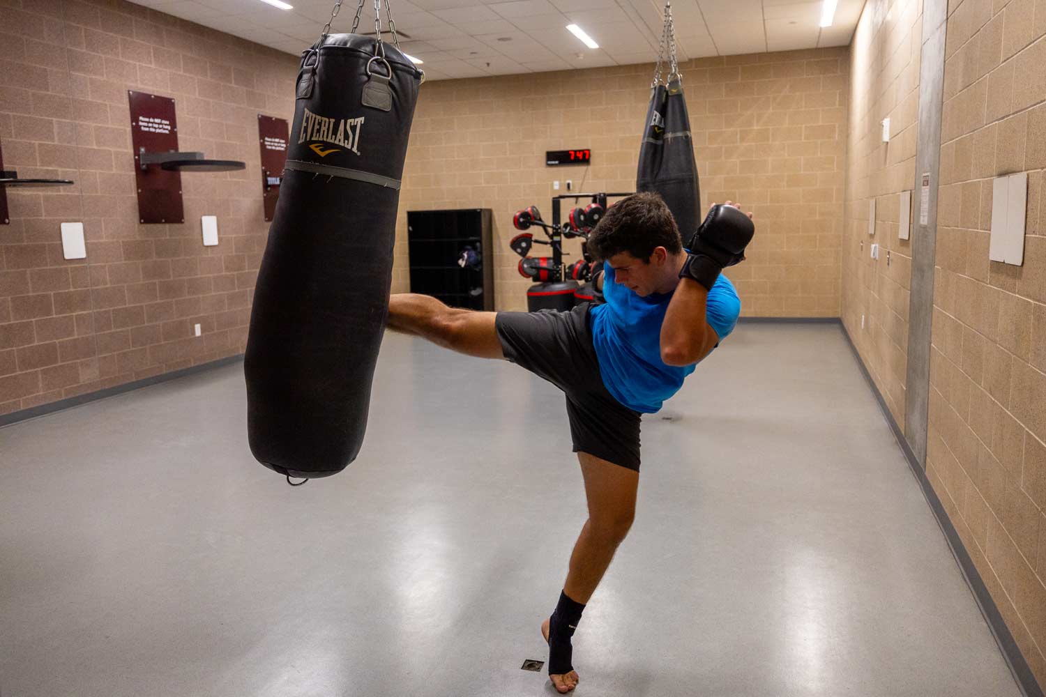 Student uses the boxing equipment and facilities within the West campus rec center