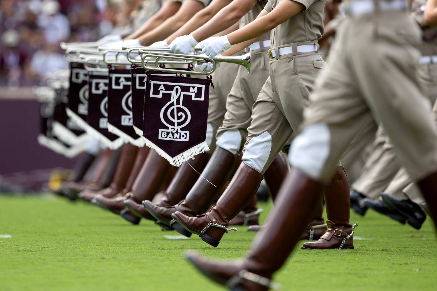 The Fightin' Texas Aggie band marches on field for their halftime performance in Kyle Field