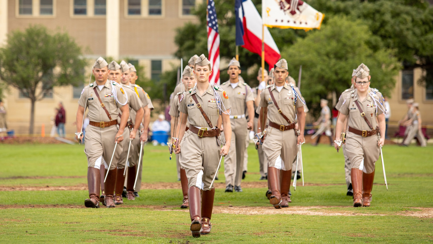 Corps of Cadets members stand at attention during final review