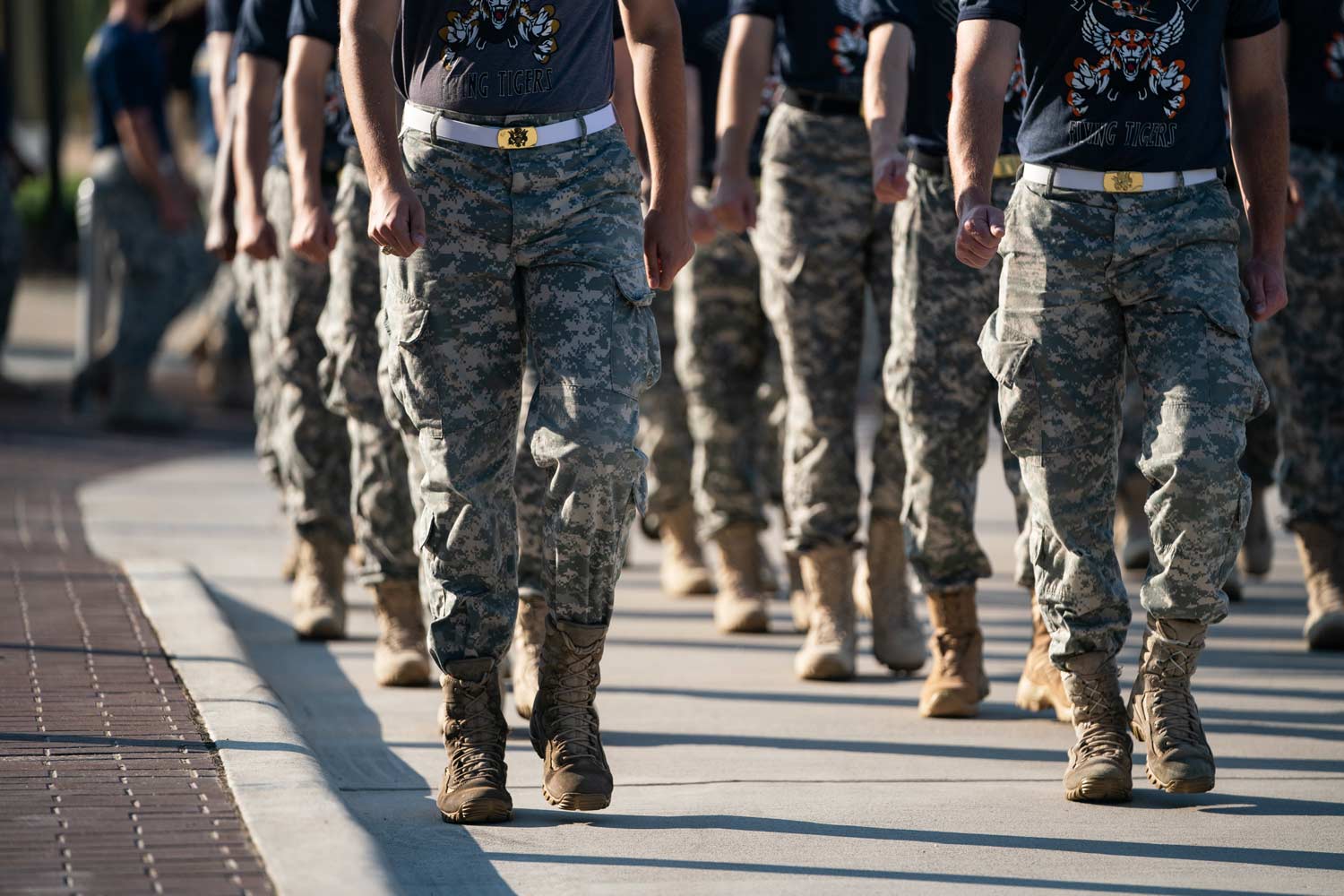 Corps of Cadets members march to the brazos in their fatigues