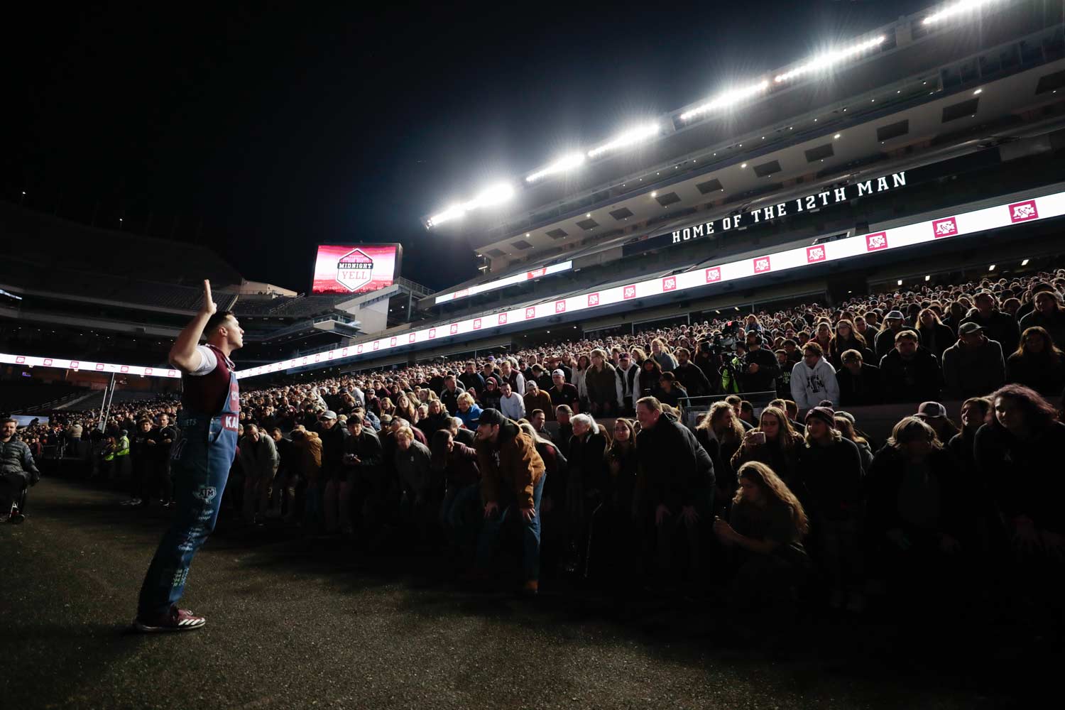 Yell leader initiating a yell to a crowded Kyle Field at Midnight Yell