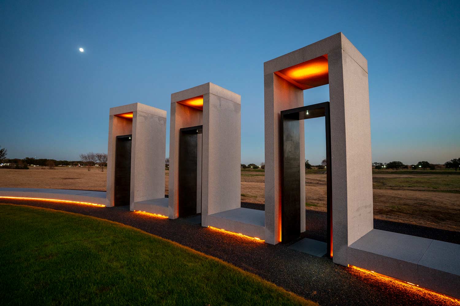 The Texas A&M Bonfire Memorial glowing at nighttime